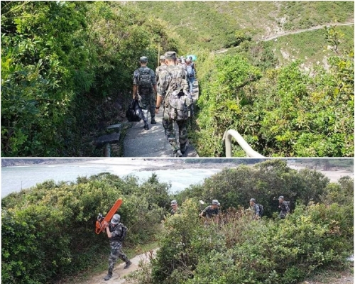 解放軍官兵協助清理樹枝。香港行山遠足之友圖片