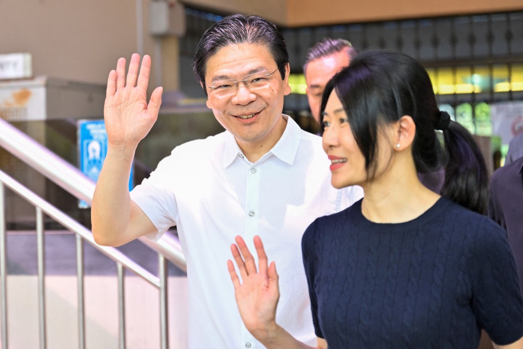 黃循財到票站投票。路透社