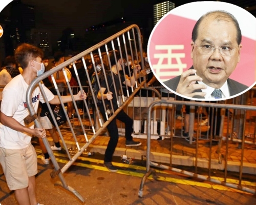 張建宗(小圖)譴責有示威者採取暴力行為。