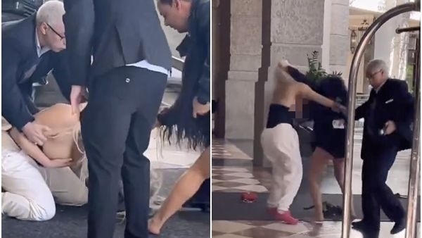 tubetop女與熱褲女打架甩衫「露巨乳」，直到男職員走近才用手遮住住春光。