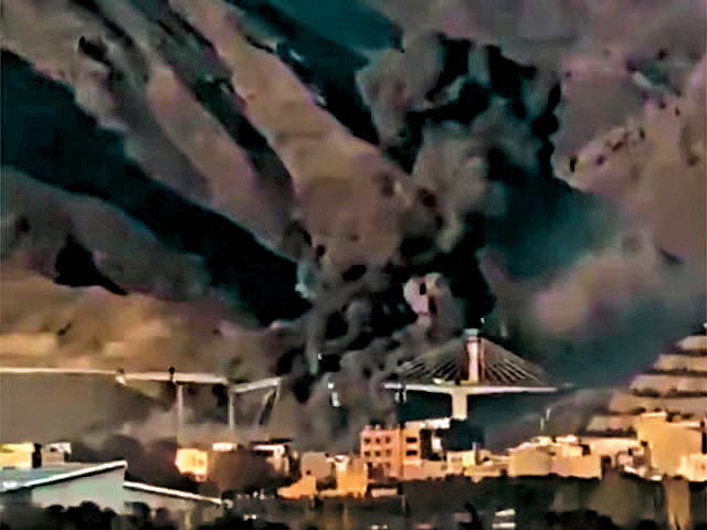 中東最高橋樑、伊朗卡拉季市貝伊克公路橋昨日遭美以空襲，斷成兩截。  