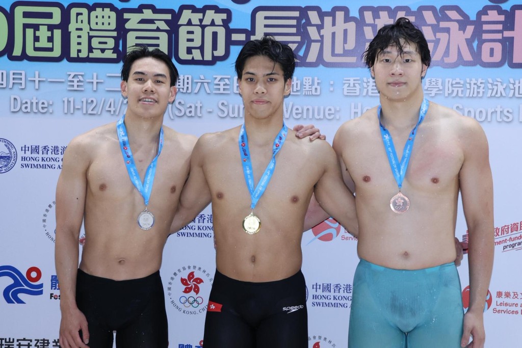 麥世霆（中）周日奪１００米蛙泳冠軍。徐嘉華攝