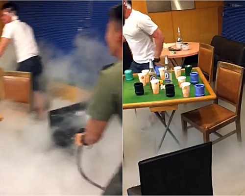 網上瘋傳片段指有懲教人員疑聚賭喝酒及噴射滅火筒玩樂。影片截圖