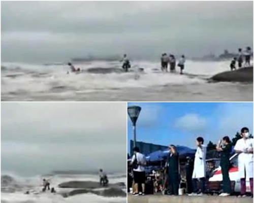 灯塔风景区岸边风高浪急，游客不顾劝阻，站上礁石拍照留念。网图