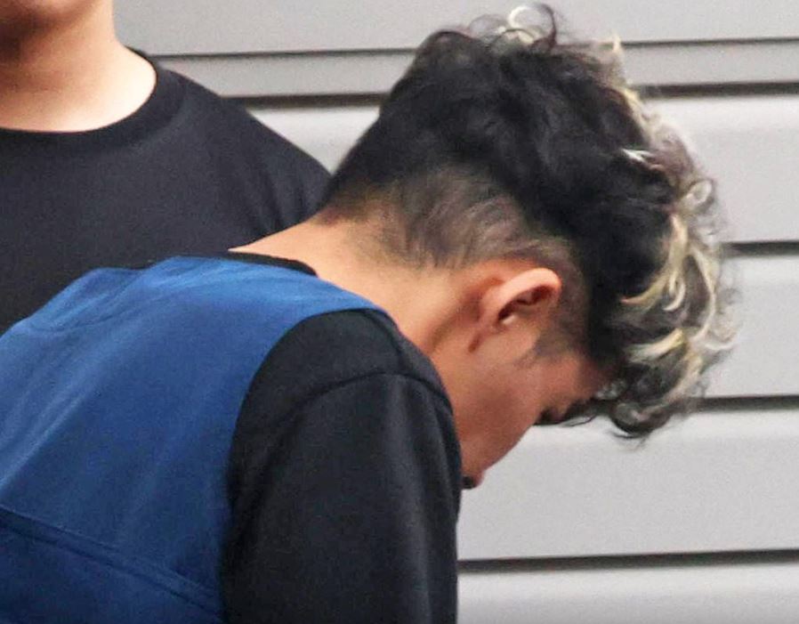 谷本將志閃避鏡頭。法新社