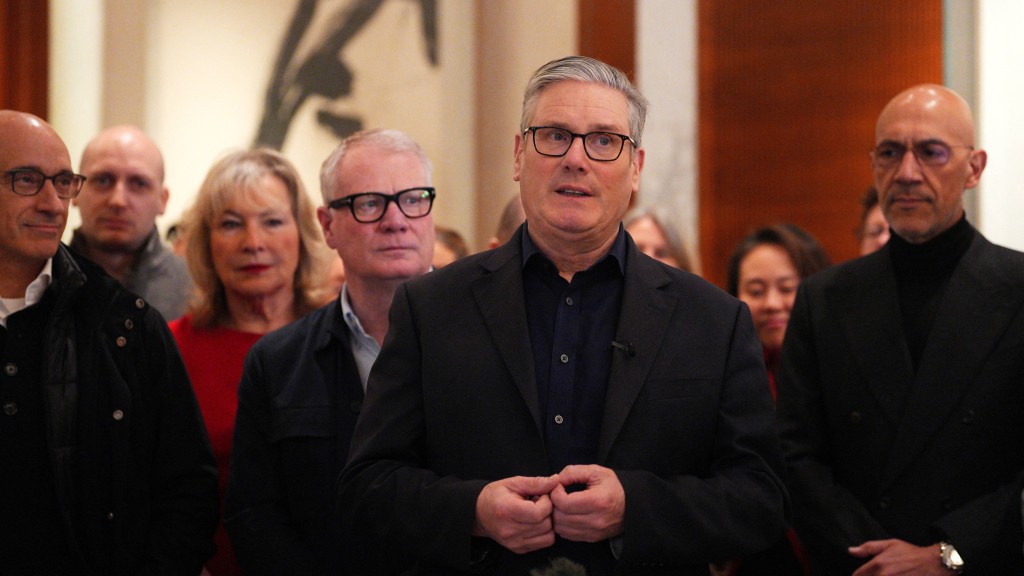 國家主席習近平今在北京人民大會堂會見來華訪問的英國首相施紀賢。 路透社