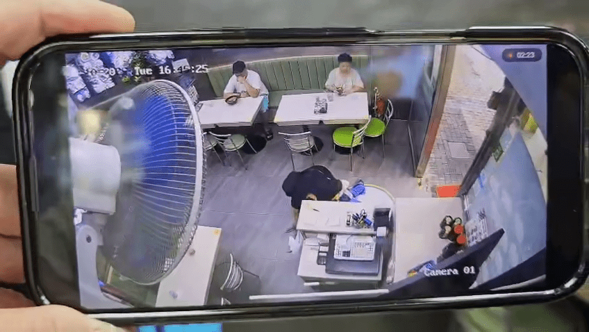 當時兩男女在收銀台附近互相糾纏。店家閉路電視片段 當時兩男女在收銀台附近互相糾纏。店家閉路電視片段