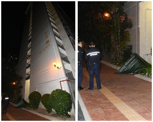 警方用帆布將屍體遮蓋。羅振輝攝