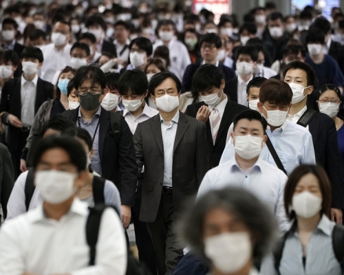 東京和北九州的新冠狀病毒疫情出現反彈。AP圖