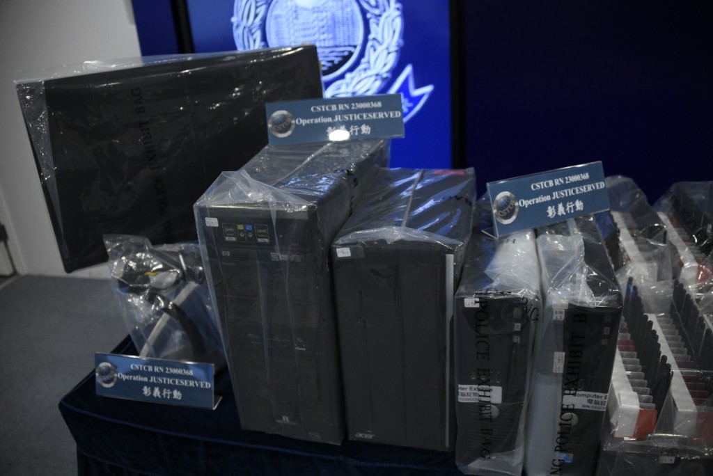行動中，警方共檢獲95部。貓池」 、29部電腦、7部手提電話、1部路由器及約65000張電話卡。