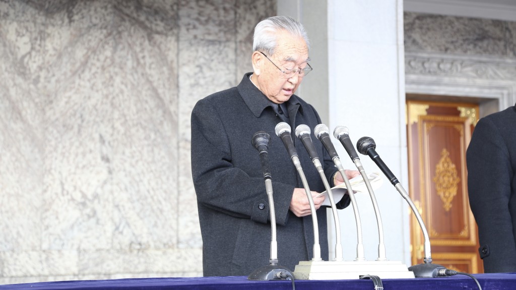 2014年，時任勞動黨中央委員會書記金己男在反對聯合國人權決議的示威活動中宣讀聲明。 新華社