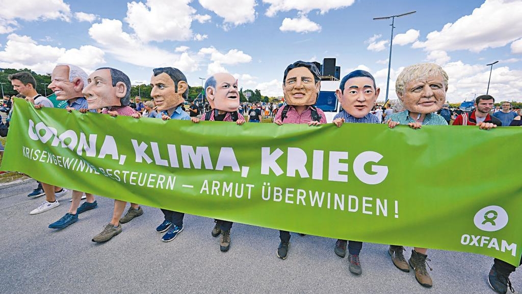 樂施會示威者在慕尼黑戴G7領袖面具抗議。
