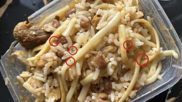 警方沒收的午餐盒，可見老鼠藥（黑點）。Polícia Militar de Minas Gerais 