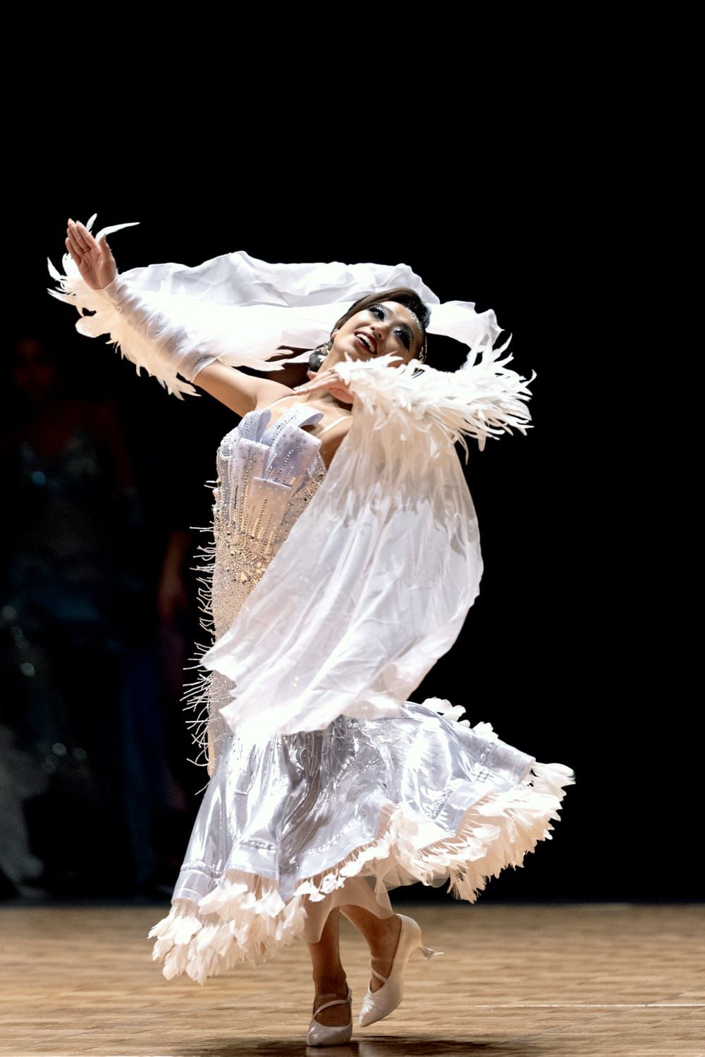 白色舞衣的黎穎彤在快步舞為香港奪得第一金。 中國香港體育舞蹈總會圖