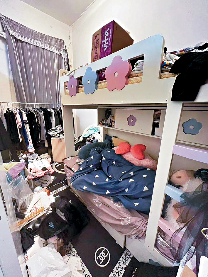 張女士與子女同住深水埗劏房，感慨月租貴令其經濟負擔很重。