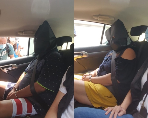 警方押解2疑犯。 林思明攝