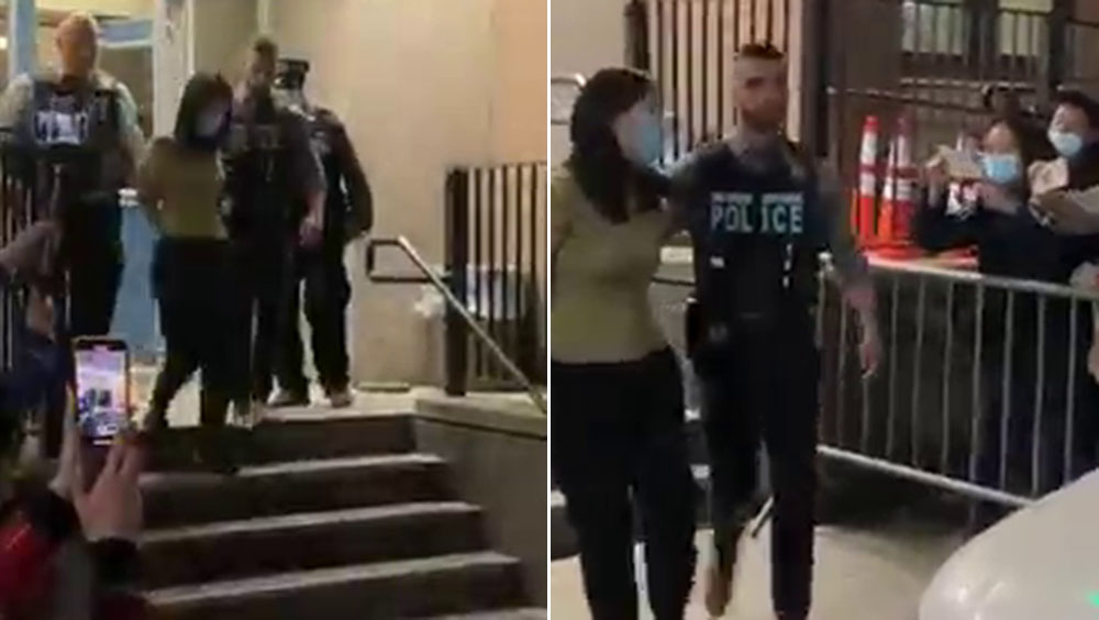 涉殺民運律師李進進疑兇張曉寧被押出警局,向群眾激動咆哮。