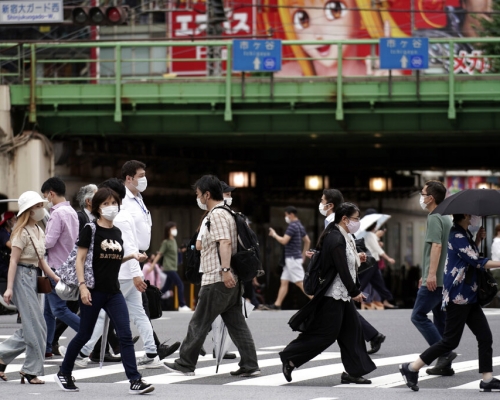 日本新冠肺炎疫情持續升溫。AP