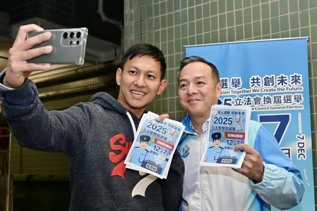 周一鳴（右）呼籲居民於12月7日「2025立法會換屆選舉」積極投票。