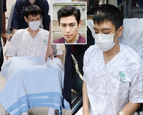T.O.P坐著輪椅被推出ICU，辦理退院手續轉到另一間醫院接受治療。（網上圖片）