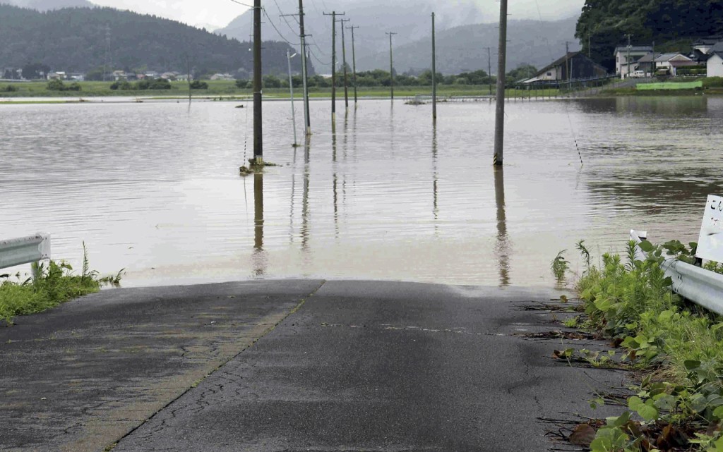 大雨導致秋田河川決堤。美聯社