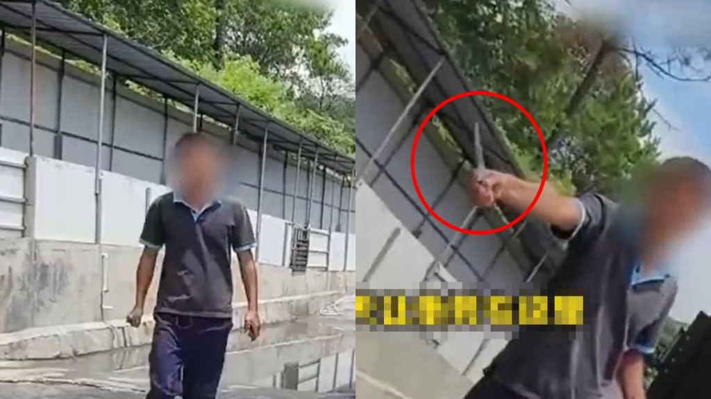 豬場員工手持利刀威嚇採訪記者。