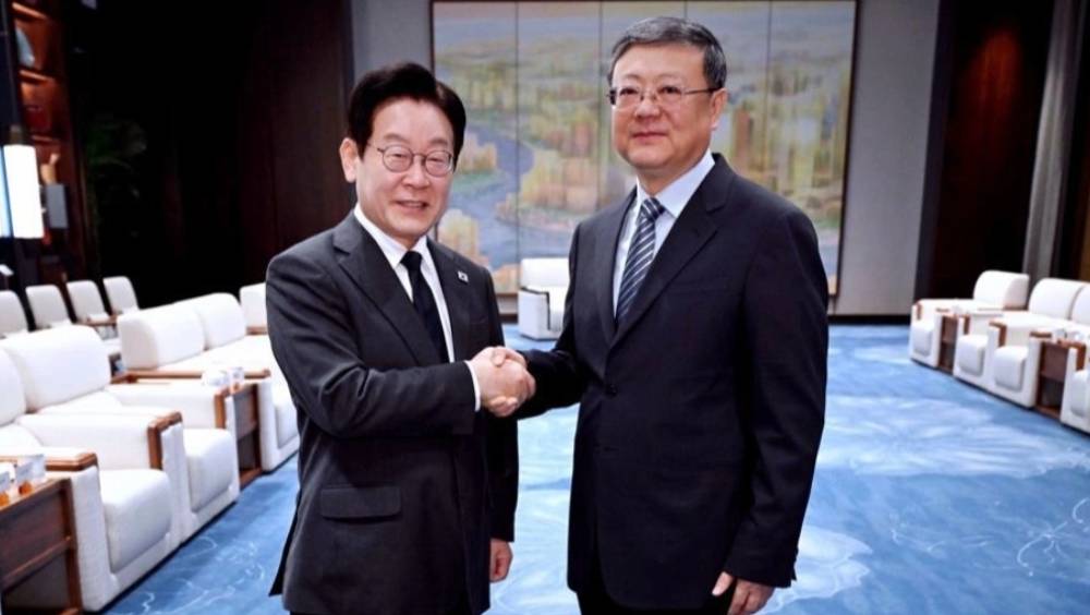 李在明與上海市委書記陳吉寧會晤。 新京報