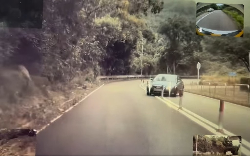 一辆奥迪房车在荃锦公路一个左弯失控漂移。(影片截图)