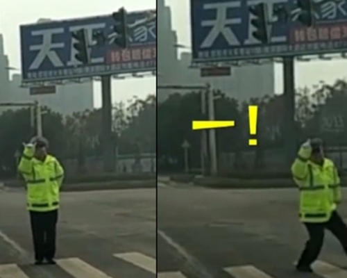 湖南一名交通警察自創「手勢舞」，在當地一個沒有讀秒功能的交通燈路口，邊跳邊提示司機和路人。 網上圖片