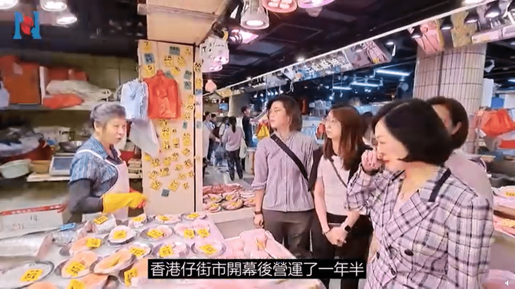 團隊向香港仔街市檔戶了解經營情況。新民黨影片截圖