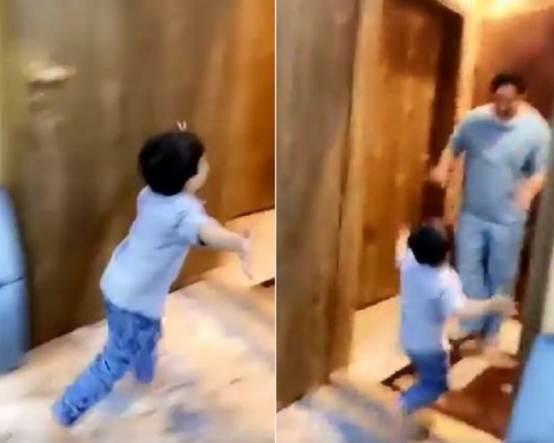 一名小孩歡喜地直奔向剛從醫院回家的醫護爸爸。網圖