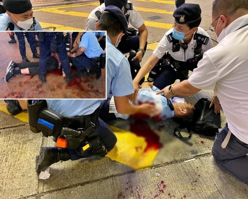 一名警員及黑衣男受傷倒地。
