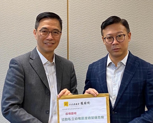 張國鈞與楊潤雄。資料圖片
