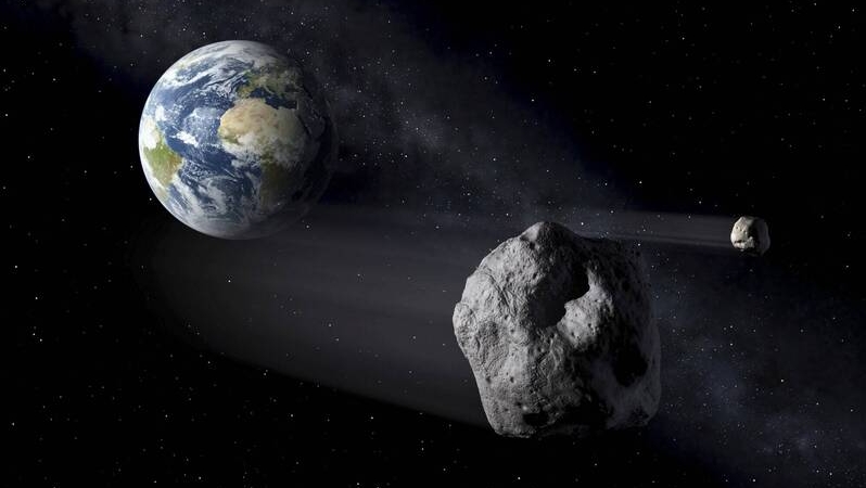 小行星掠過地球模擬圖。 美聯社