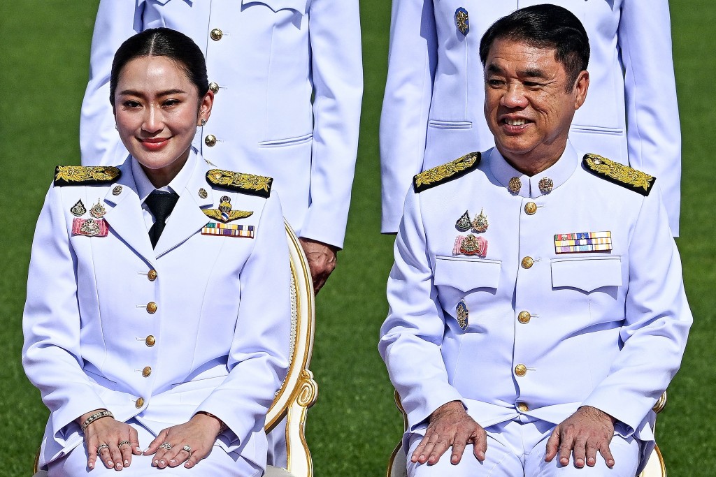 佩通坦與莊俊奇。法新社