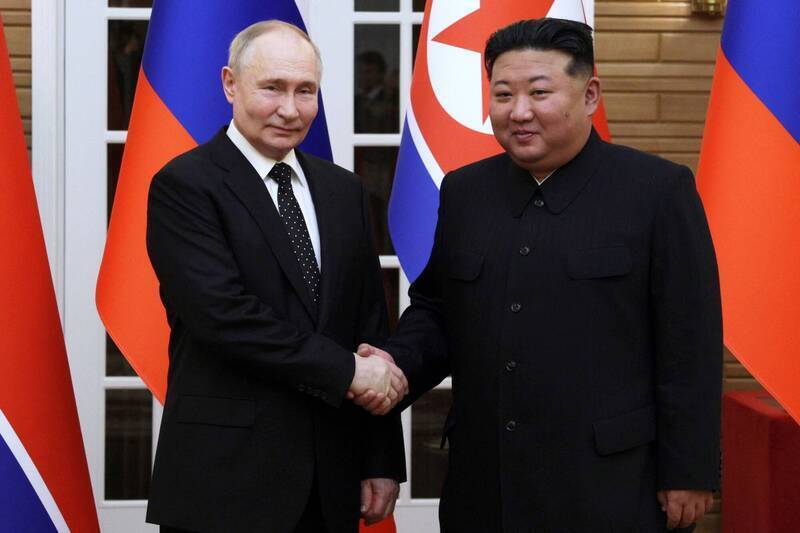 金正恩表明堅定支援普京。路透社