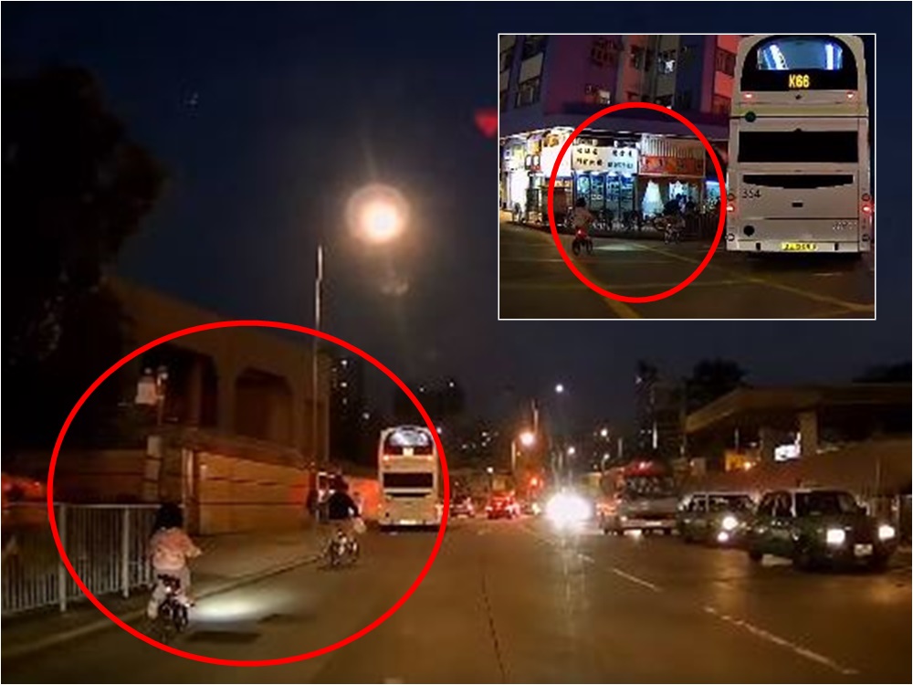 元朗一對父女在馬路上踩單車,父親竟獨留女兒在後。FB群組「我食在元朗。你卻在大牌檔」網民Kaki Fong影片截圖