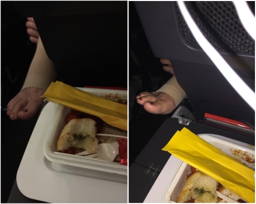 澳航有男乘客抱怨進食飛機餐時，前座一名女乘客從縫隙間伸出一隻腳，靠在他的餐盤旁。網圖
