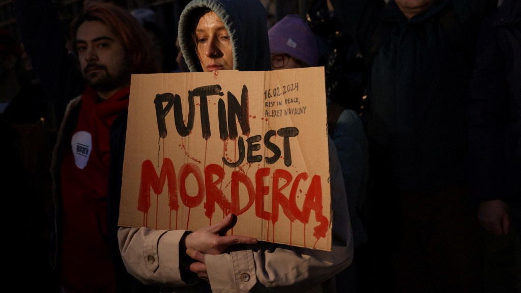 波兰华沙民众指责普京是“杀手凶手”。 路透社