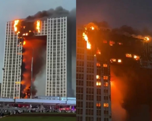 大连著名公寓昨日下午起火浓烟冲天，火势至晚上11时才被扑灭。网图