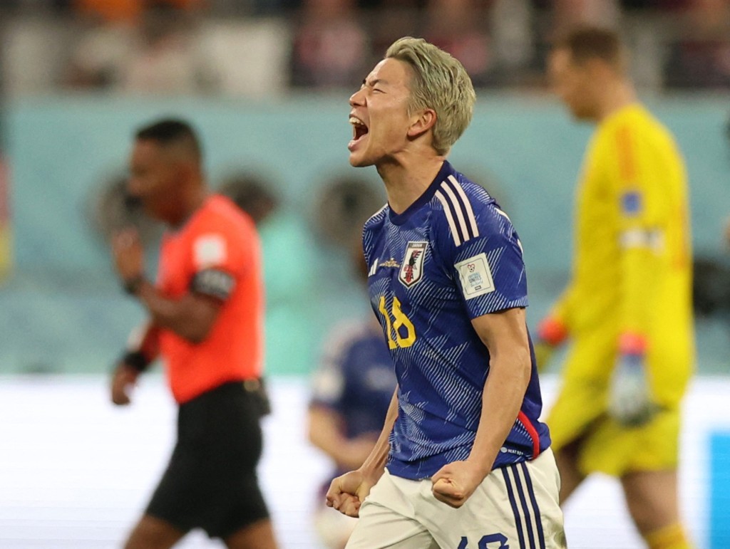 日本鋒將淺野拓磨慶祝擊敗德國。Reuters