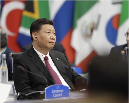 習近平在會議上就討論貿易問題時發表意見。 AP