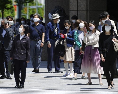 日本東京都新增1050人確診。AP圖片