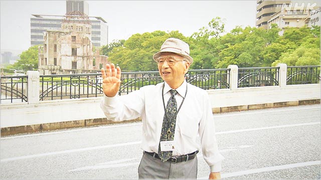 饭田国彦经常到广岛和平纪念公园与游客交流。NHK截图
