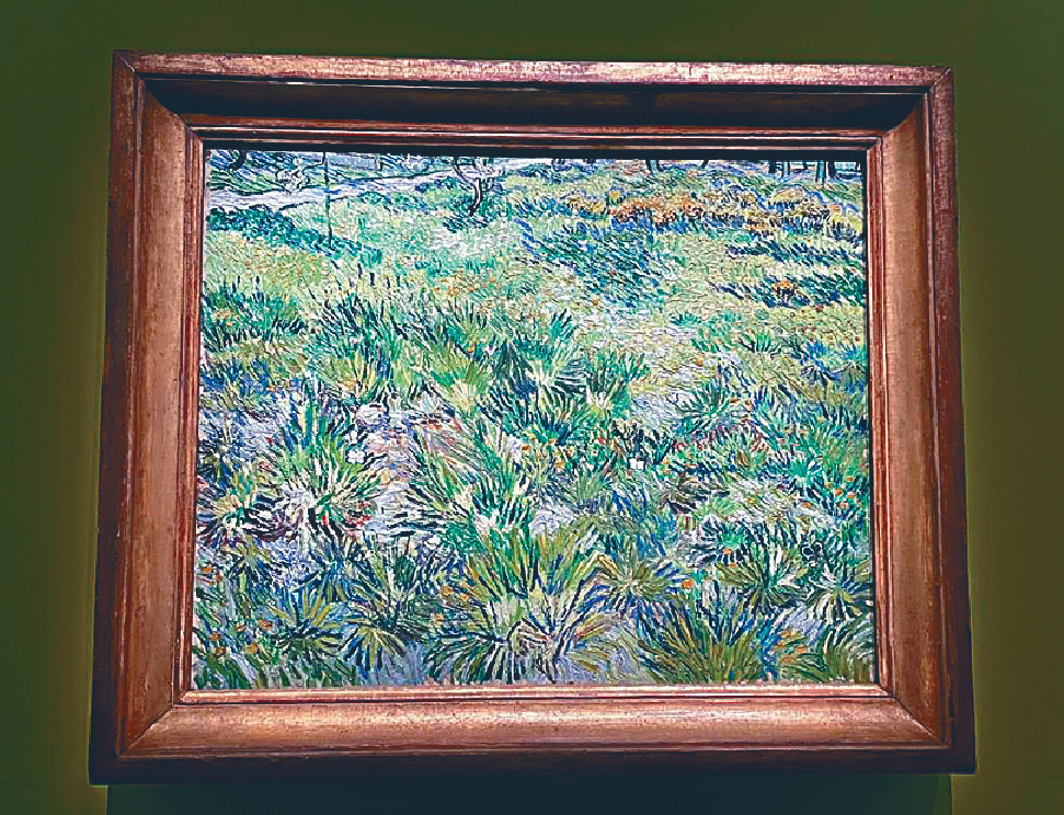 ■梵高的《長草地與蝴蝶》。
