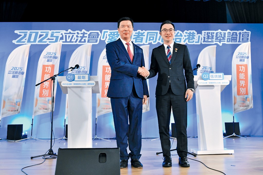 商界(第三)候选人，严刚（左）及张琪腾。