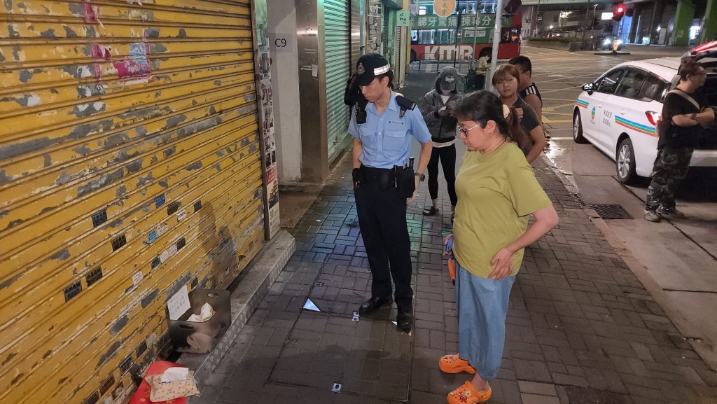 報案人廖小姐（綠衣）。黎志偉攝