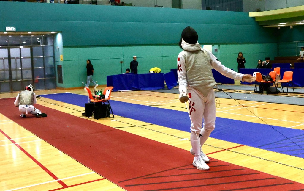 在男花团守尾门的“大孖”何承沣（右）胜出后大喊出来，左为喇沙书院代表。徐嘉华摄