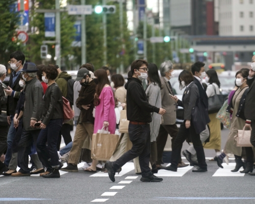 日本下調中國等9個國家及地區的疫情警戒級別。 AP圖