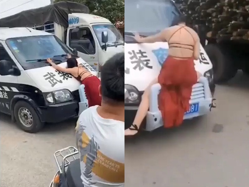 女子攔運鈔車。網圖